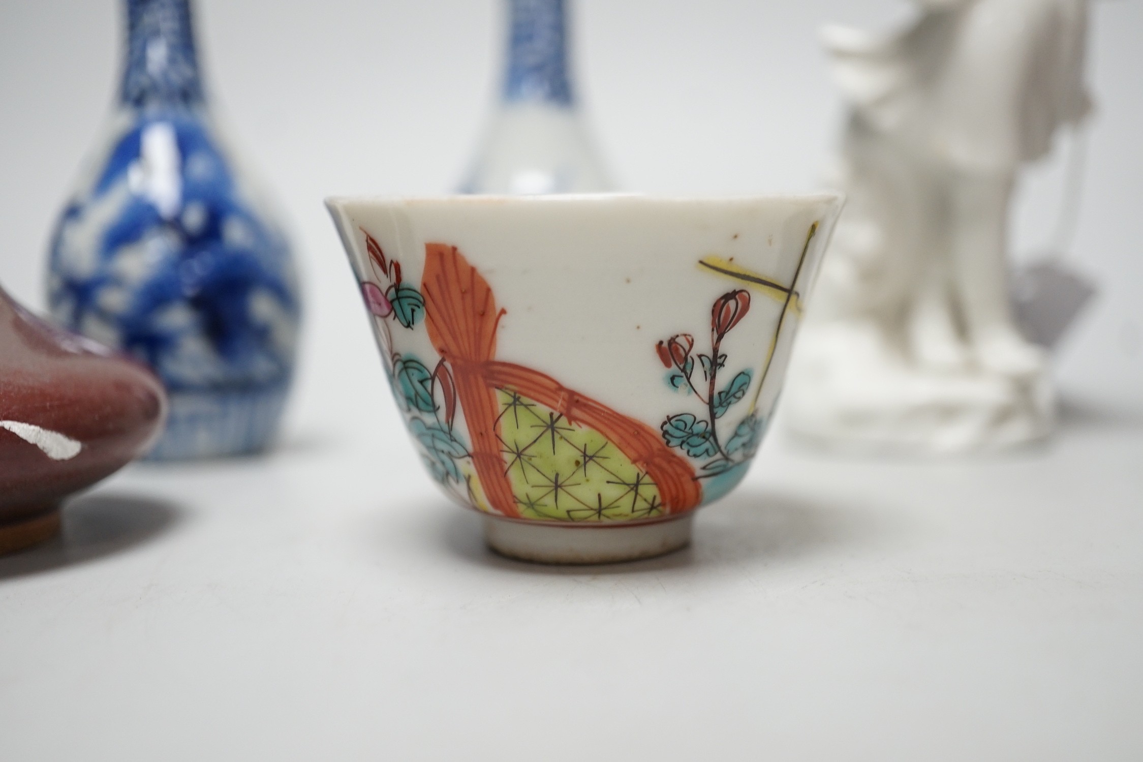 A Chinese sang de boeuf bottle neck vase, together with four Chinese miniature vases, three Chinese figures and a Chinese tea bowl, tallest 15cm